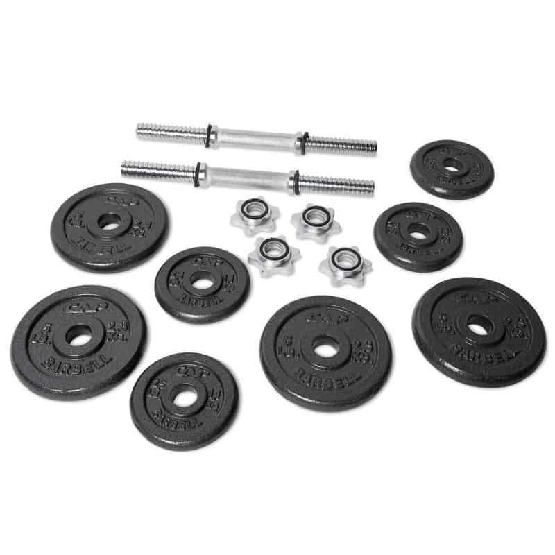 selection of weight plates and dumbbell bar white background