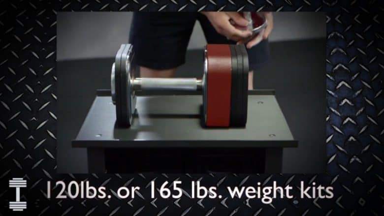 heavy dumbbell 150lb add on man adding extentionpack to ironmaster dumbbell