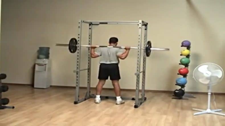 power rack body solid body builder squatting using power rack