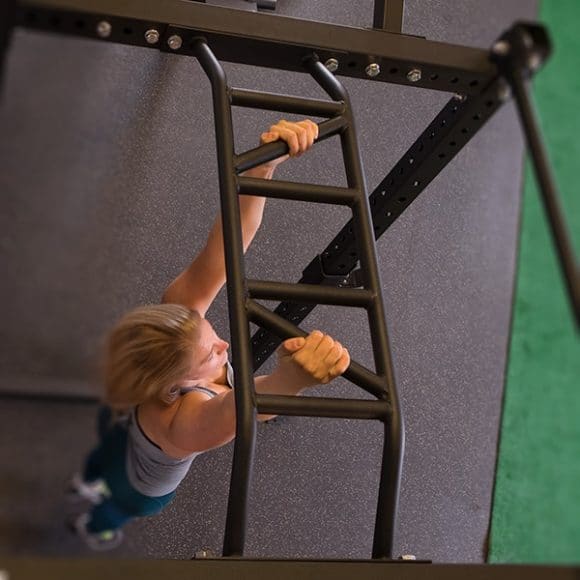 woman performing pull up on multi grip pull up bar of spr rack
