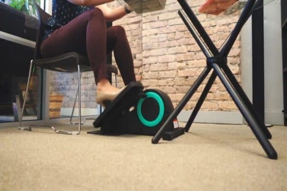 woman exercsing on cubii under desk elliptical