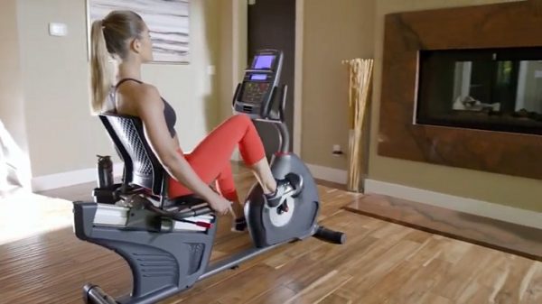 schwinn 270 home gym woman cycling on schwinn 270 recumbent bike