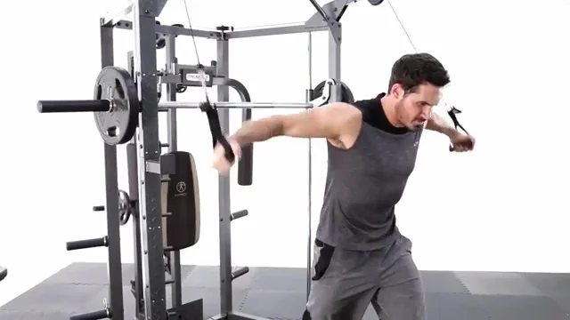 man performing cable crossovers on marcy diamond elite smith machine