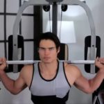 man performing squats using diamond elite smith machine