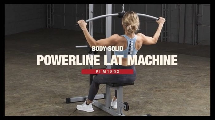 female bodybuilder performing lat pulls on Powerline lat machine