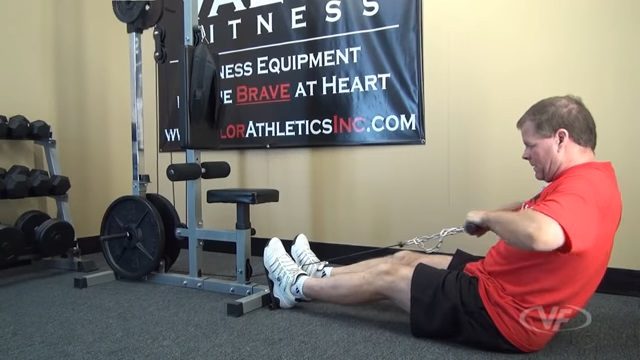 valor fitness cb-12 low pulley man performing seated cable rows on Valor Fitness CB 12 lat pull down machine