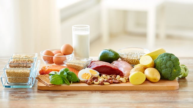 various healthy food placed on a wooden board