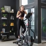 woman exercising on schwinn A40 elliptical machine in her home