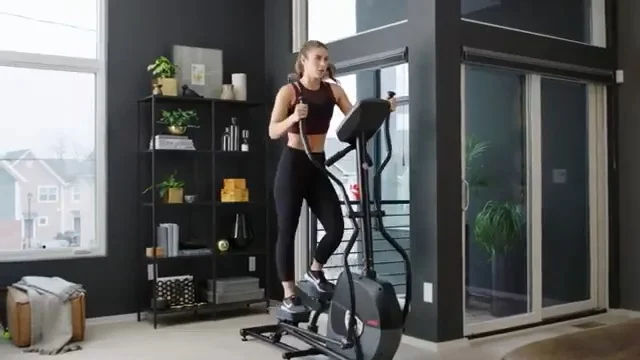 woman exercising on schwinn A40 elliptical machine in her home