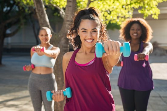 young women doing fat burning workouts outdoors