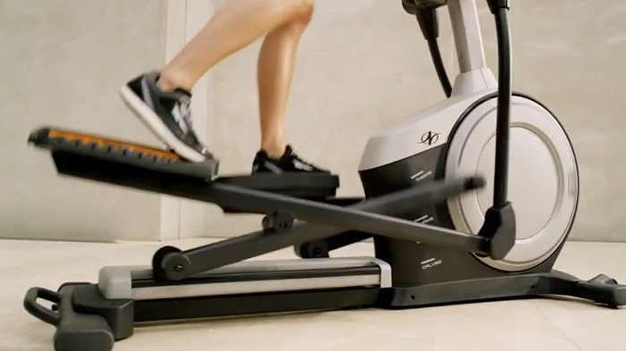 NordicTrack C 7.5 Elliptical machine women demonstrating stride length of C.75 NordicTrack elliptical