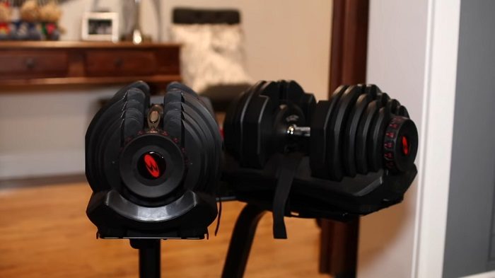 pair of bowflex 1090 dumbbells in home gym