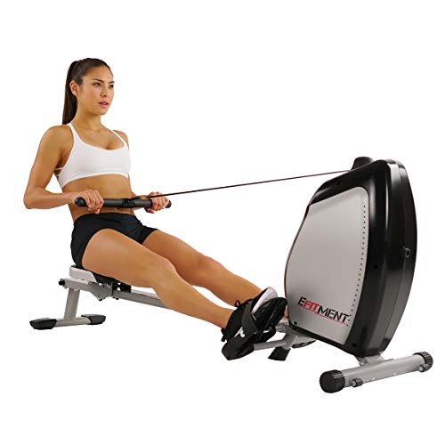 Efitment rowing machine woman rowing on efit rowing machine in a home gym
