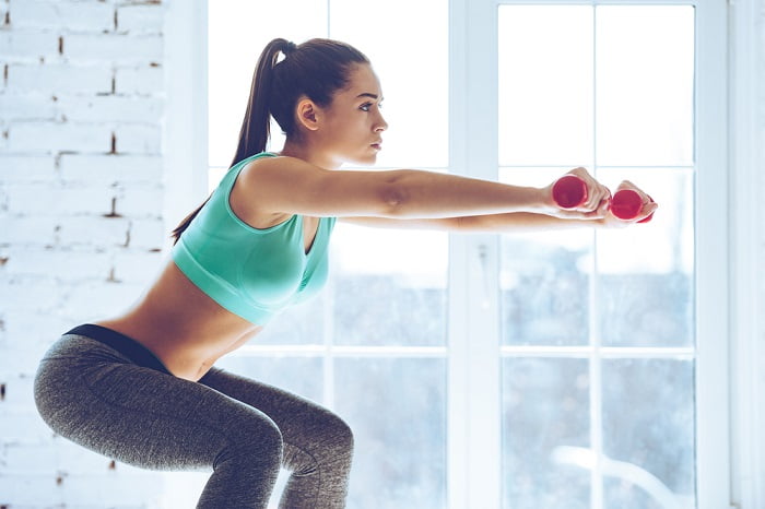 woman doing exercises that lift your butt young fit woman doing squats