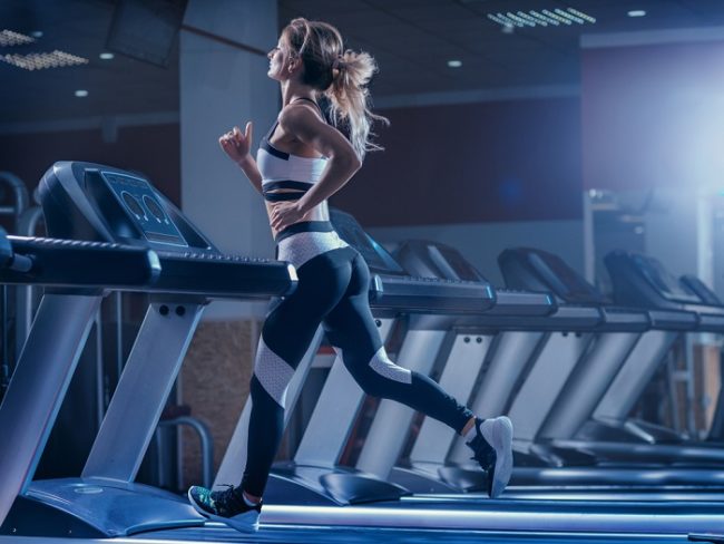 treadmill workout young woman using a treadmill