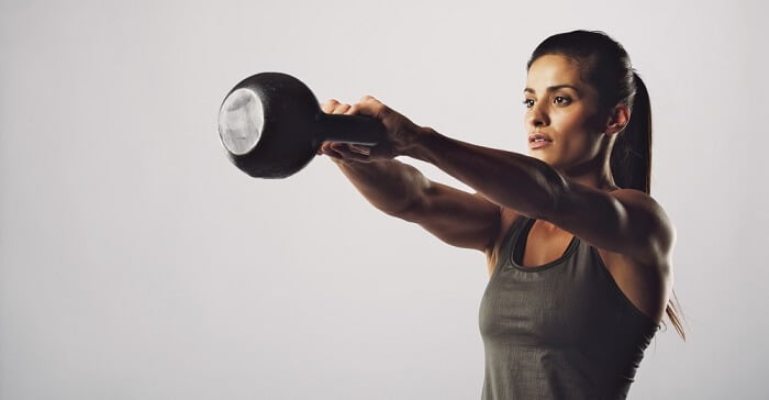 woman exercising with weights women doing one set workout