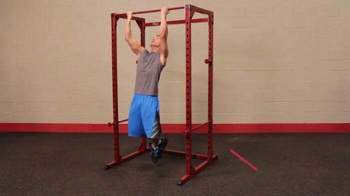 Best Fitness Power Rack BFPR100 man performing pull ups on best fitness power rack BFPR100