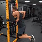 man performing dips on powertec power rack