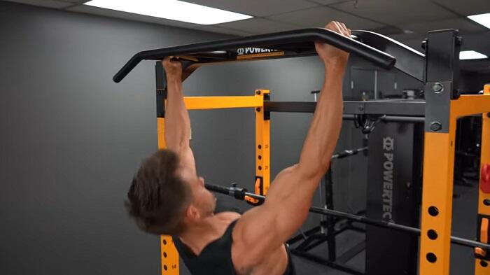 Powertec Workbench Power Rack pull up bars man performing pull ups on powertec power rack