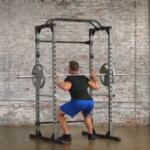 man performing squats inside progear 1600 ultra strength rack