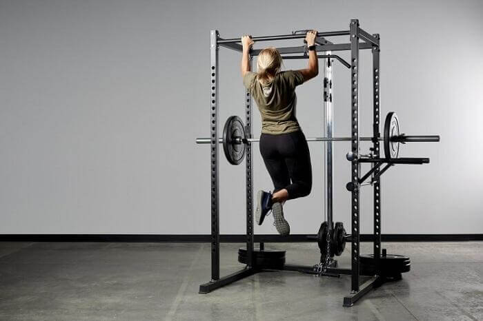 rep pr-1000 power rack with attachments woman performing pull ups on rep-pr-1000