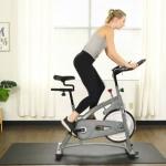 woman cycling on best budget spin bike at home