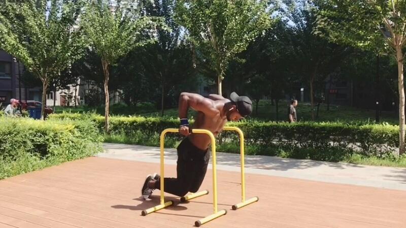 tricep dips outside on parallel dip bars