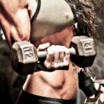 fit woman holding dumbbells