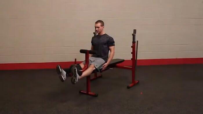 Best Fitness Olympic Bench BFOB10 leg press man performing legs curls ob best fitness olympic bench