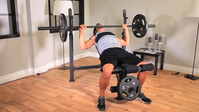 Competitor Olympic Weight Bench _ CB-729 bench press man performing bench press on competitor olympic weight bench