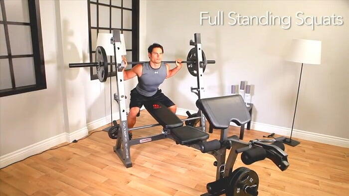Marcy Diamond Elite Olympic Bench _ MD-857 suqat stand man using squatting rack of marcy md -857 olympic bench