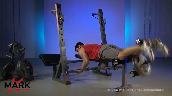 man using leg developer xmark international olympic bench