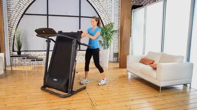Exerpeutic TF1000 Ultra High Capacity Walk to Fitness Electric Treadmill woman folding Exerpeutic TF1000 treadmill