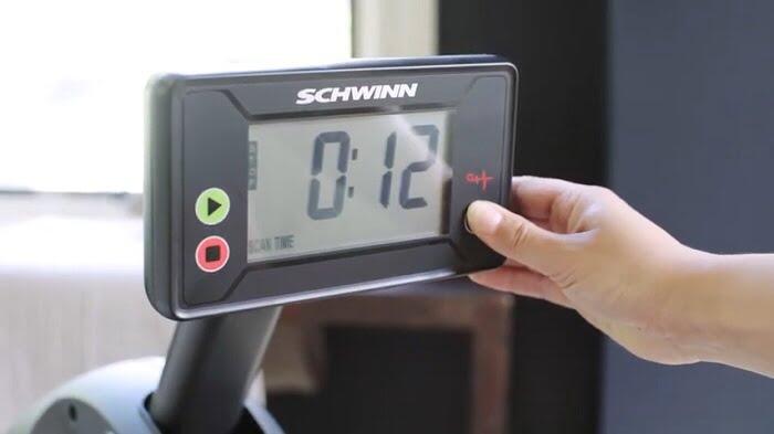 woman selecting time on schwinn monitor