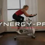 woman riding sunny synergy pro sf-b1851 in her home