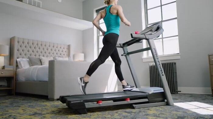 woman running on proform 400i treadmill woman running on proform 400i treadmill at home