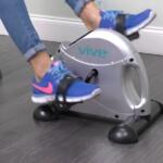 woman using vive pedal exerciser under her desk
