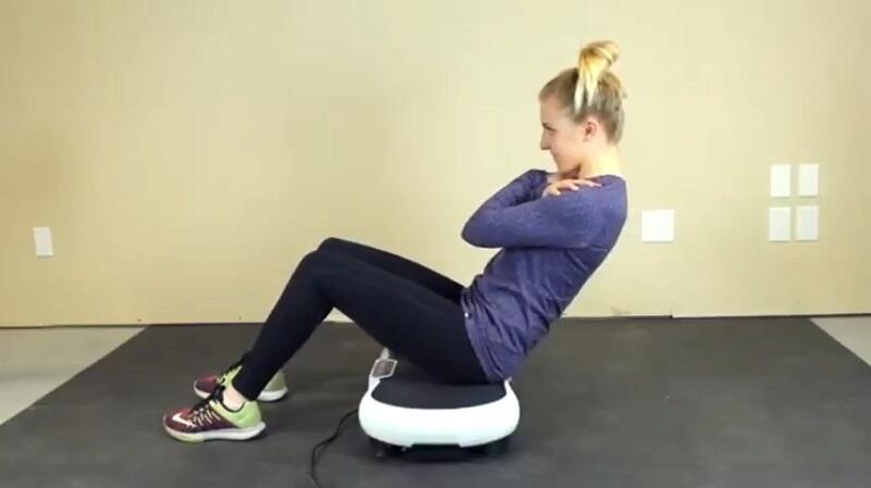 woman performing sit ups on hurtle fitness vibration platform