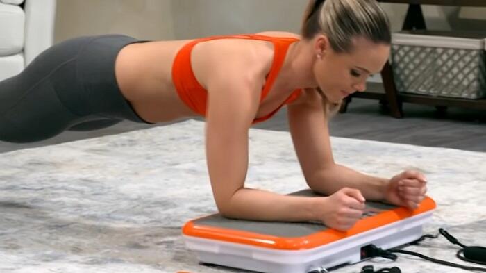 woman exercsing on powerfit vibration machine
