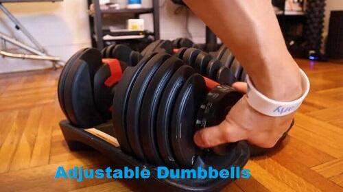 man adjusting 50lb dumbbell