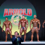 five bodybuilder on stage at competition