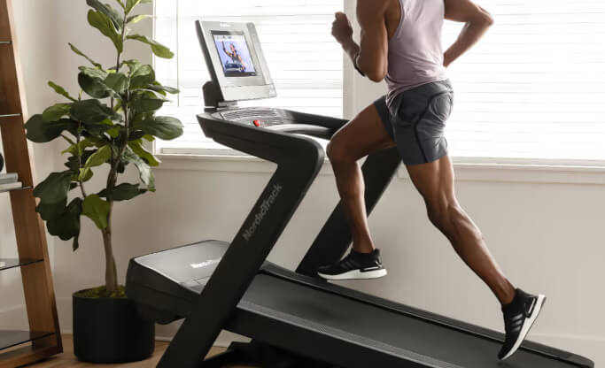 man jogging on NordicTrack Commercial 1750 treadmill