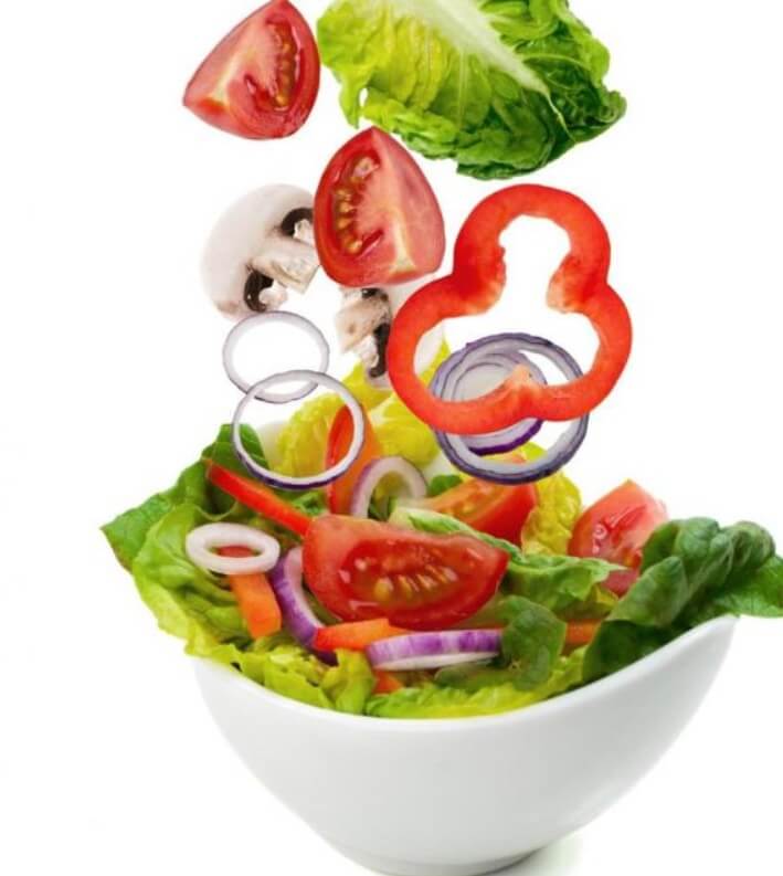 get fit at home vegetables falling in a white bowl