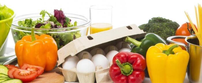how to get fit in 28 days carton of 10 eggs surrounded with vegetables