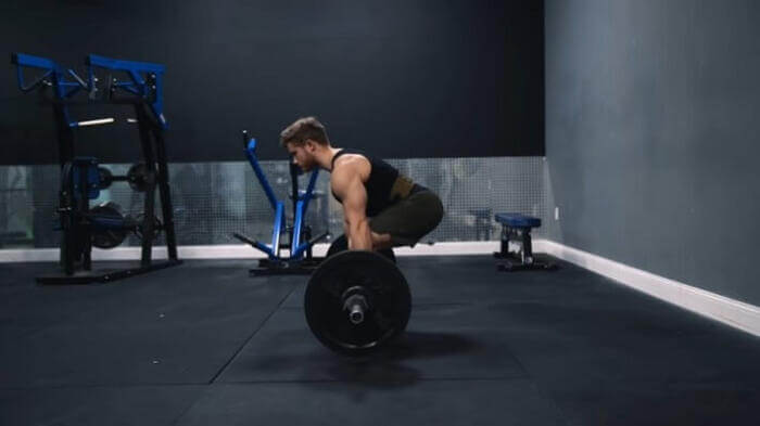 man performing deadlift man performing the deadlift with full focus