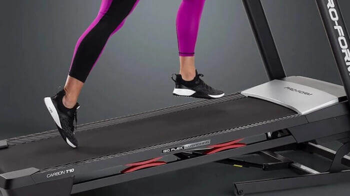 woman walking on proform carbon 10 inclined treadmill belt