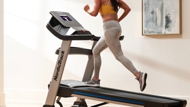 woman running on nordictrack 10i treadmill