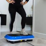 woman performing exercises on vibration plates