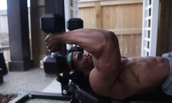 man performing tricep workout two arm tricep exercise