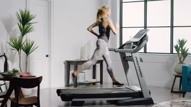 proform pro 2000 with woman woman running on proform pro 2000 in her home
